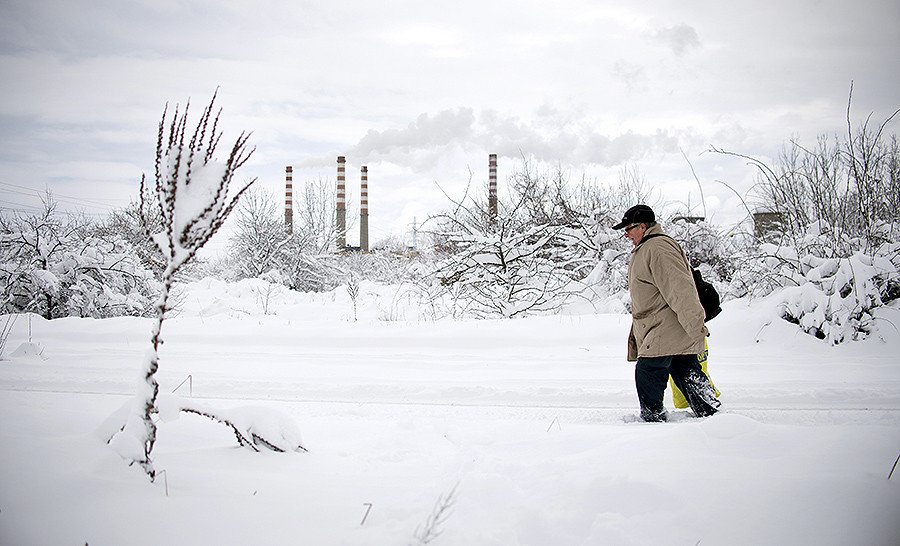 A man walks in a suburb of Sofia after heavy snowfall on January 7, 2017.