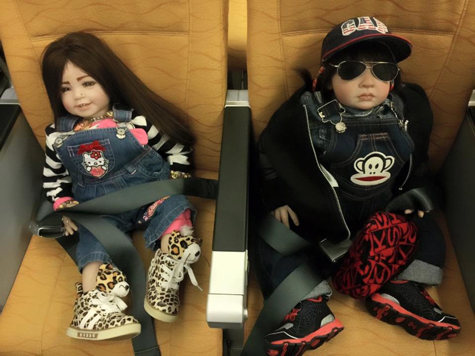 Luk Thep dolls on plane