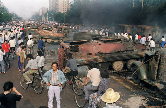 Torched armor vehicles near Tiananmen Square 1989