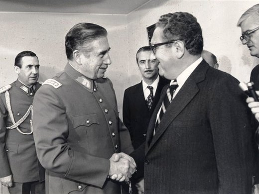 Pinochet shaking hand with Kissinger