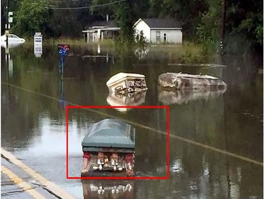 Coffins floating on street in Louisiana flood