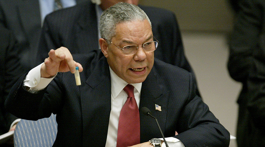 Colin Powell holds up a vial