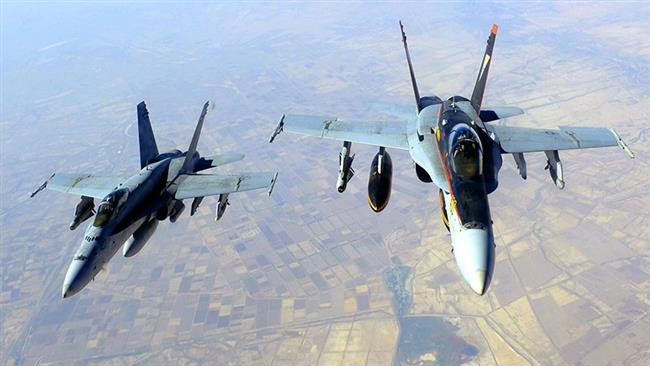 This file photo shows two US Navy F/A-18E Super Hornets supporting the operations against Daesh terrorists, after being refueled by a KC-135 Stratotanker over Iraq. 