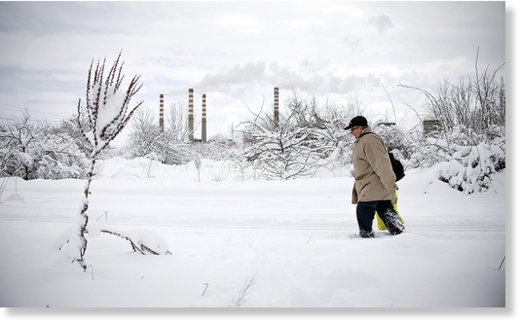 A man walks in a suburb of Sofia after heavy snowfall on January 7, 2017.