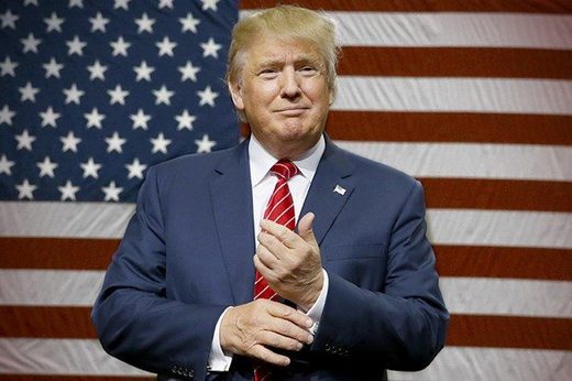 Republican presidential candidate Donald Trump speaks to supporters as he takes the stage for a campaign event in Dallas, Monday, Sept. 14, 2015