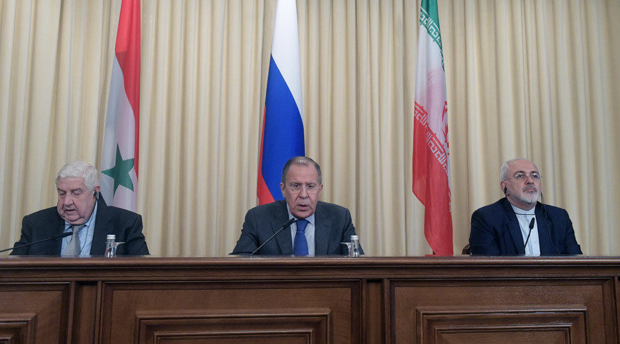 Foreign Ministers, Sergei Lavrov (C) of Russia, Walid al-Muallem (L) of Syria and Mohammad Javad Zarif of Iran attend a news conference in Moscow