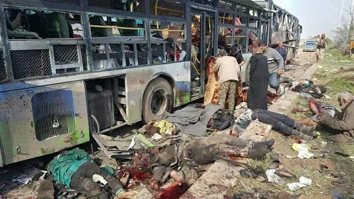 Nhấn để phóng to Still image shows bodies lying near burnt out buses in what is said to be Aleppo's outskirts