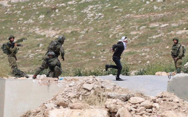 Israel soldiers shot Palestinian bound, blindfolded teenager